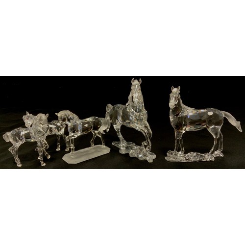 55 - Swarovski Crystal models including; Stallion, 14cm high, another similar, 13cm high, others foals, a... 