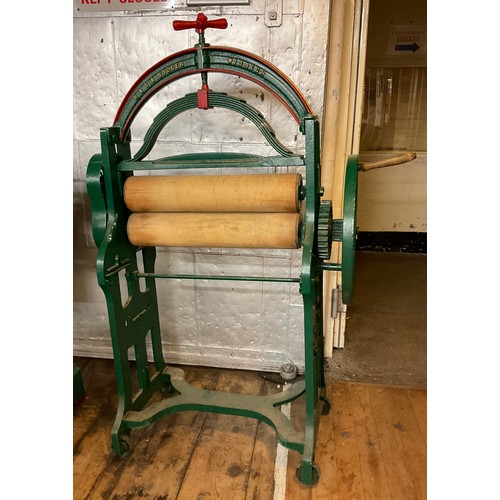 4 - An R & S.A Bodger of Wisbech cast iron mangle , wooden rollers, green and red painted body, 150cm hi... 