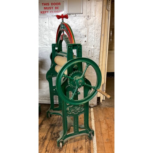 4 - An R & S.A Bodger of Wisbech cast iron mangle , wooden rollers, green and red painted body, 150cm hi... 