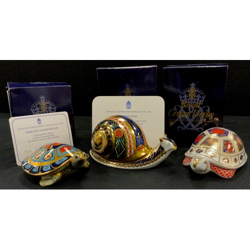 61 - Royal Crown Derby paperweights including; Garden Snail, limited edition of 235/4500, with stopper an... 