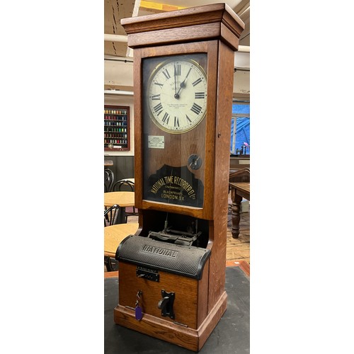 40 - A National Time Recorder Co., Ltd., ‘National Electric’ clocking-in machine, oak cased, 108cm high x... 