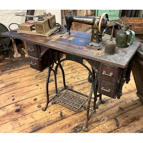 49 - A Wheeler & Wilson treadle sewing machine;  etc.