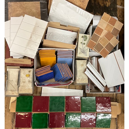 51 - A quantity of ceramic tiles, various patterns and colours.