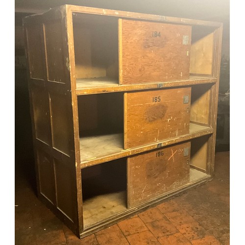 81 - A large pine industrial three tier cabinet, deep frame each layer with single sliding door, 183cm hi... 