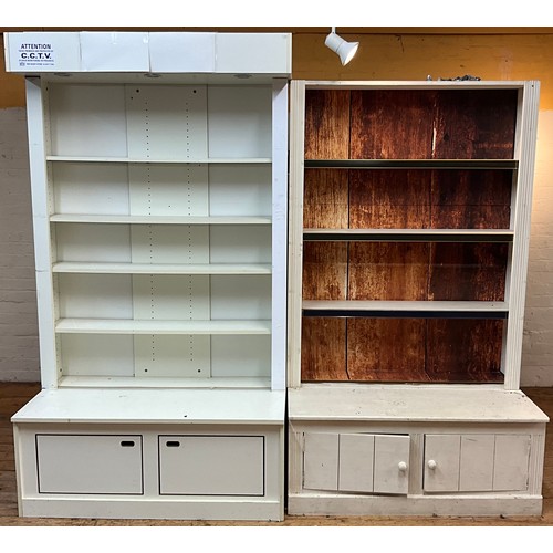 86 - A contemporary shop display unit, with five shelves over two cupboards to base, 215cm high, 121cm wi... 