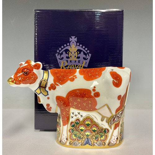 5051 - A Royal Crown Derby paperweight, Daisy Cow, gold stopper, 21cm wide, printed mark in red, boxed