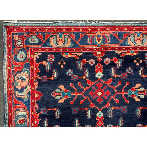 196 - A Hand-knotted Persian Malayer type woollen tribal rug, 203cm x 158cm.