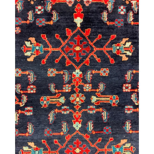 196 - A Hand-knotted Persian Malayer type woollen tribal rug, 203cm x 158cm.