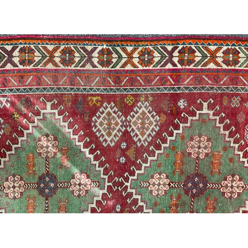 207 - A Kazak type hand-knotted rug, 272 cm x 145 cm, mid 20th century.