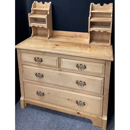 218 - A pine dressing chest, the upper super-structure with pair of small drawers and shelves either side ... 