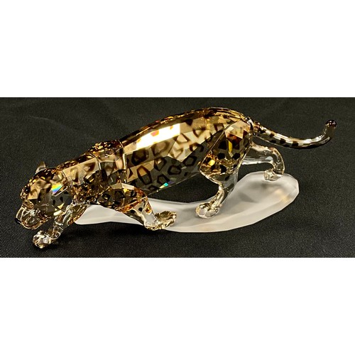 91 - Swarovski crystal Jaguar model on frosted plinth, 17cm long, boxed.