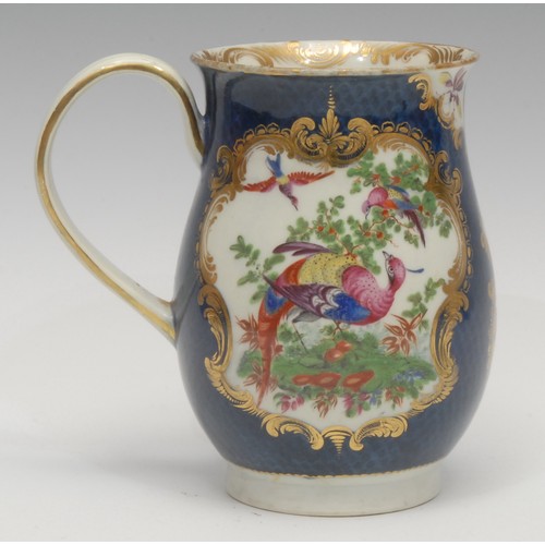 95 - A large Worcester bell shaped mug, painted with fanciful birds within gilt cartouches, the scale blu... 