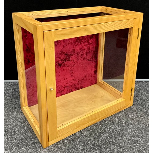 272 - A Table top bijouterie cabinet, glazed ash wood case, the interior lined with red velvet to base / b... 