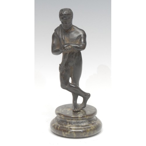 336 - A dark patinated figural bronze, of Hercules, he stands on one leg with his club at his knee, waiste... 