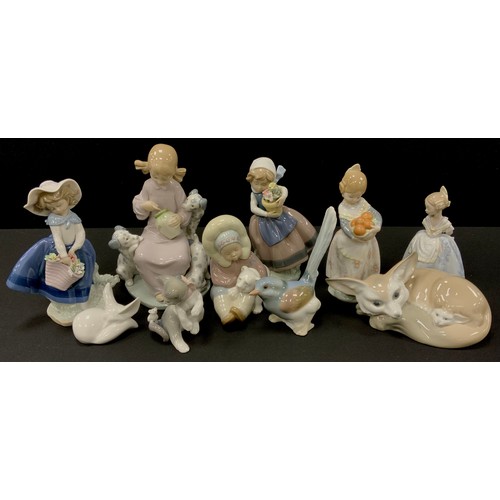 363 - Lladro figures including; Artic Fox 19cm long, Girl with honey 20cm high, other figures (9)