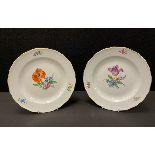 370 - A pair of Meissen botanical plates, each decorated with bouquets, shaped gilt rims, blue crossed swo... 