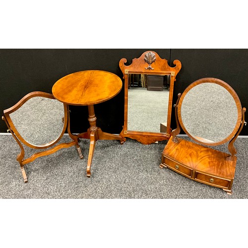 402 - A George III revival mahogany dressing table mirror, Oval looking glass on cradle supports, above a ... 