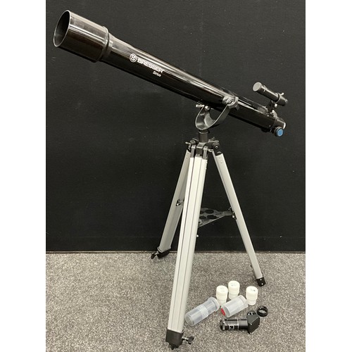 424 - A Bresser 70mm refractor telescope, with tripod, and additional lenses.