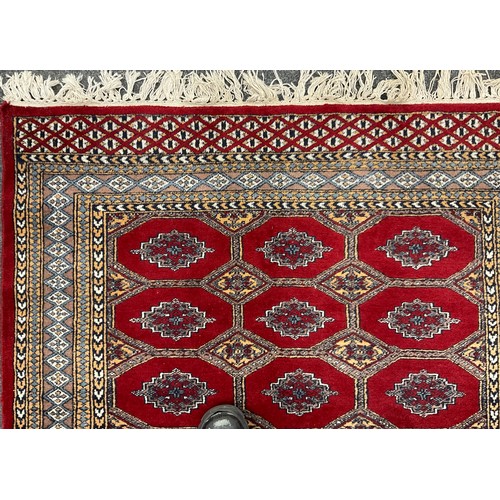 458 - A Bokhara type Rug / carpet, 188cm x 122cm.