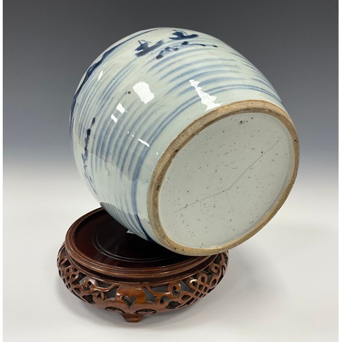 467 - A 19th century Chinese under glaze blue and white ginger jar, painted with an oriental landscape of ... 