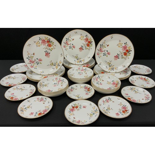 513 - Royal Albert China Rose New Romance pattern comprised of; twelve dinner plates, twelve bowls, eleven... 