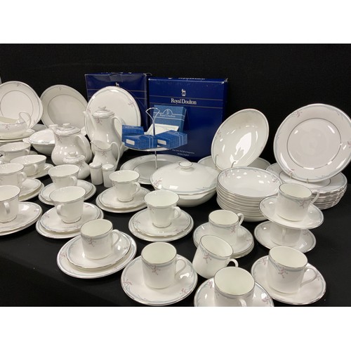 514 - Royal Doulton Carnation pattern table service for eight including; one meat platter, double cake sta... 