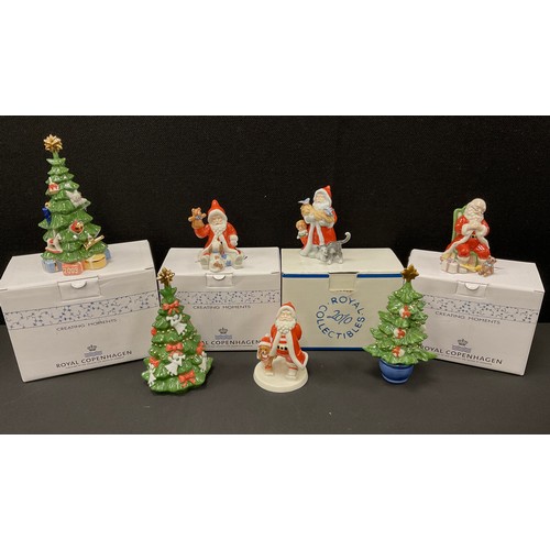 530 - A collection of Royal Copenhagen porcelain Christmas figures, Santa and Christmas trees, 2007, 2008,... 