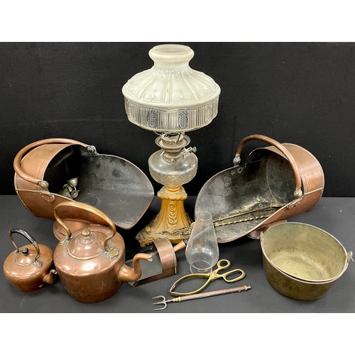 556 - A Victorian copper coal scuttle, another, similar;  Victorian oil lamp converted for use with electr... 