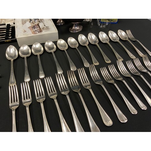 583 - A pair of silver plated sauce boats,  a Picard Ingenium Caffe,  assorted cased and loose flatware , ... 