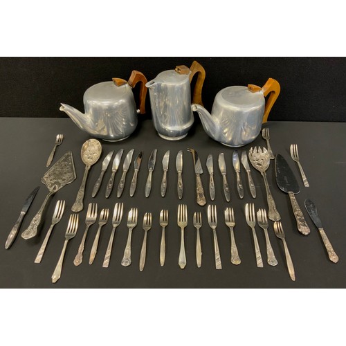 586 - A Picquot ware three piece tea set, silver hafted cake knife, etc other assorted flatware.