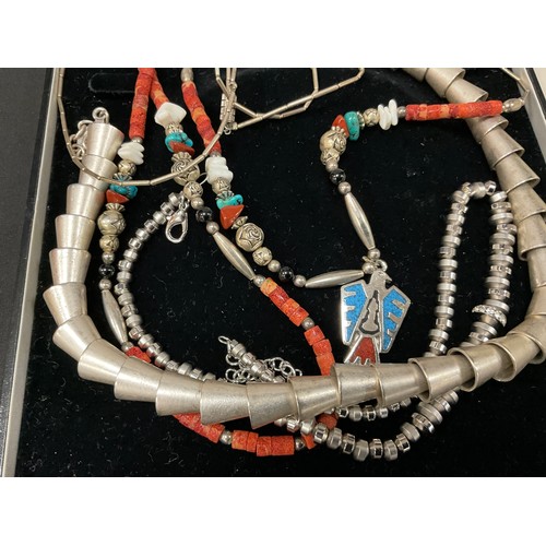 687 - A white metal conical interconnected tubular bead necklace, another smaller beads;  Mexican/ Navajo ... 