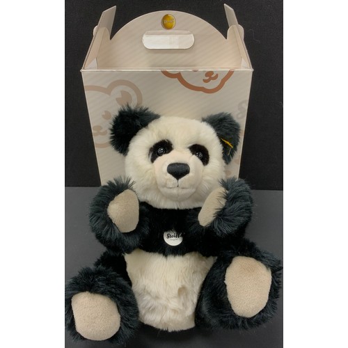 6392 - A Steiff stuffed Panda bear, yellow ear tag, number 010637, 36cm high, boxed