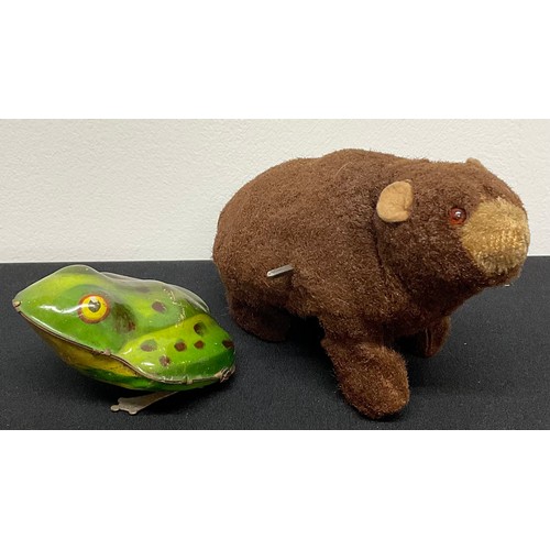 6410 - A German Marx tin plate clockwork frog, 8.5cm; a Japanese clockwork grizzly bear, 13cm long (2)