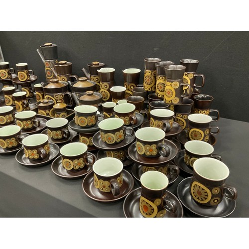 543 - A extensive Denby Arabbesque tea and coffee service including; three tea pots, coffee service, sugar... 