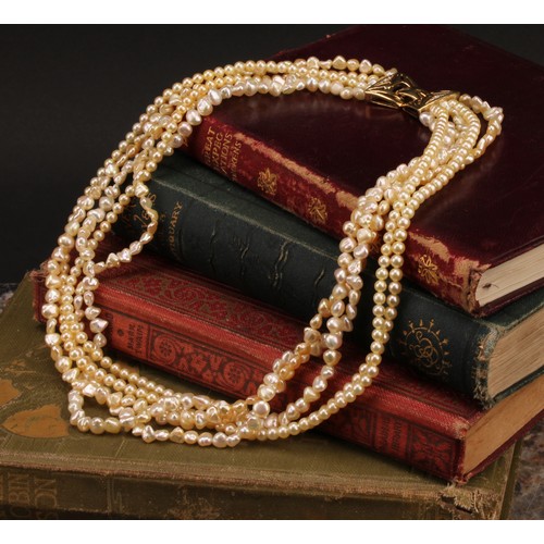 867 - A South Sea Islands five strand cultured and fresh water pearl necklace, with free form and globular... 