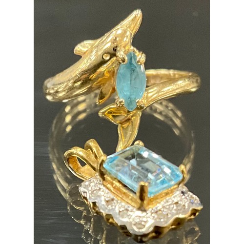 902 - A topaz and yellow metal dress ring, the shank as Dolphin, stamped 14k, KBN, size L, 2.6g gross; a t... 