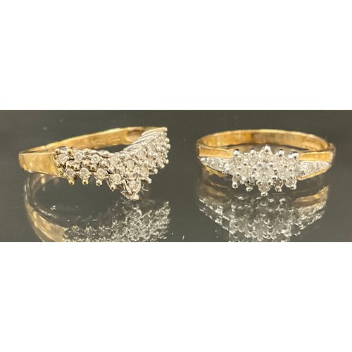 905 - A 9ct gold diamond cluster ring, approx 0.20ct, size L, 2g gross; another V shaped cluster, stamped ... 