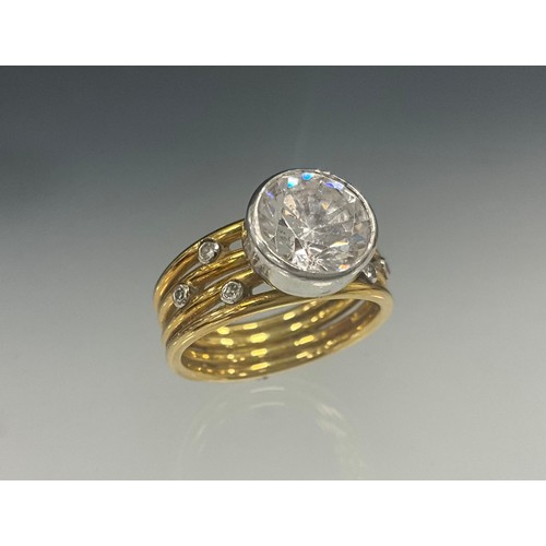 908 - A Nicholas Wylde diamond and white stone dress ring, principle white stone, possibly a sapphire, whi... 