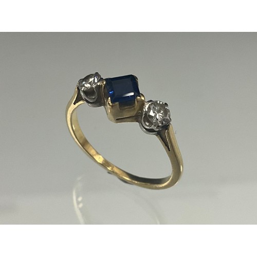 911 - A diamond and sapphire ring, central sqaure cut mid blue sapphire approx 0.12ct, dividing two round ... 