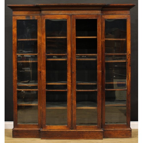 2460 - A Victorian rosewood library bookcase, outswept cornice above four doors enclosing adjustable shelve... 