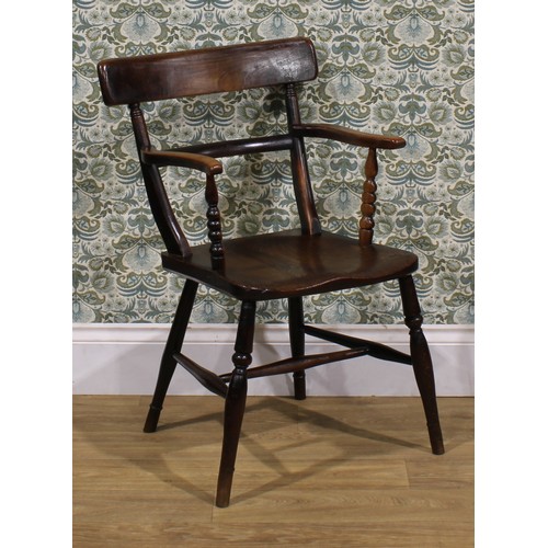 2468 - An early 19th century elm and beech bar back Windsor elbow chair, serpentine arms on bobbin-turned s... 