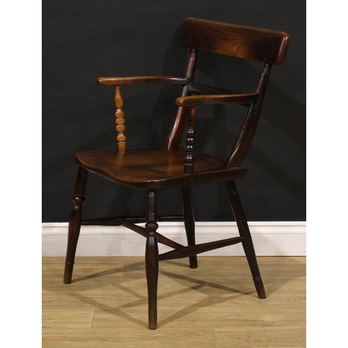 2468 - An early 19th century elm and beech bar back Windsor elbow chair, serpentine arms on bobbin-turned s... 