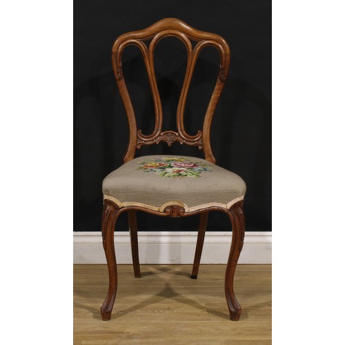 2456 - A set of six Victorian walnut dining chairs, in the French Provincial taste, stuffed-over needlework... 