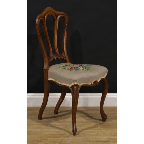 2456 - A set of six Victorian walnut dining chairs, in the French Provincial taste, stuffed-over needlework... 