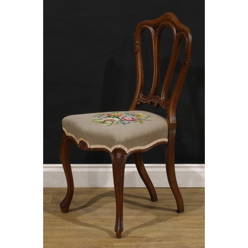 2456 - A set of six Victorian walnut dining chairs, in the French Provincial taste, stuffed-over needlework... 