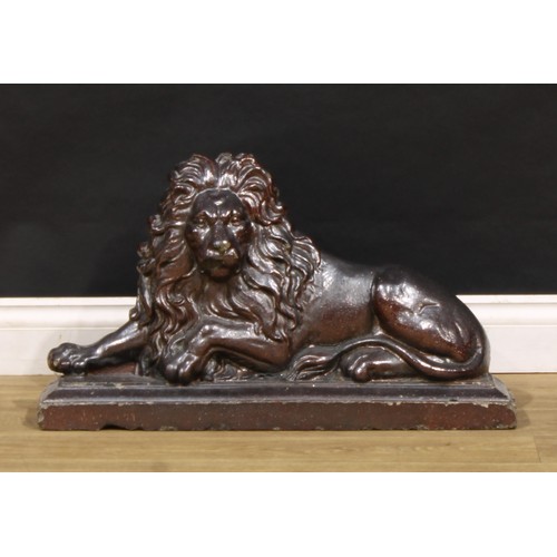 2438 - A Victorian salt glazed stoneware country house door porter, as a recumbent lion, 39.5cm high, 70cm ... 