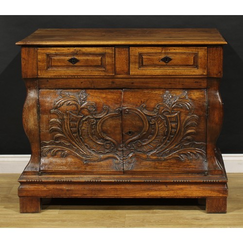 1884 - A 19th century French Provincial walnut bombe shaped press commode, rectangular top above a pair of ... 