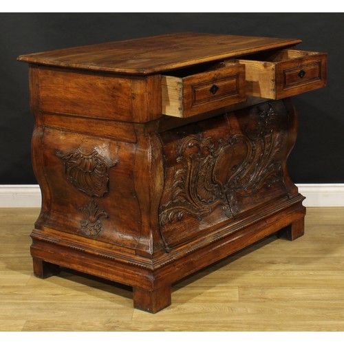 1884 - A 19th century French Provincial walnut bombe shaped press commode, rectangular top above a pair of ... 