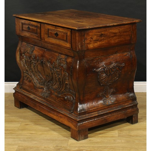 1884 - A 19th century French Provincial walnut bombe shaped press commode, rectangular top above a pair of ... 