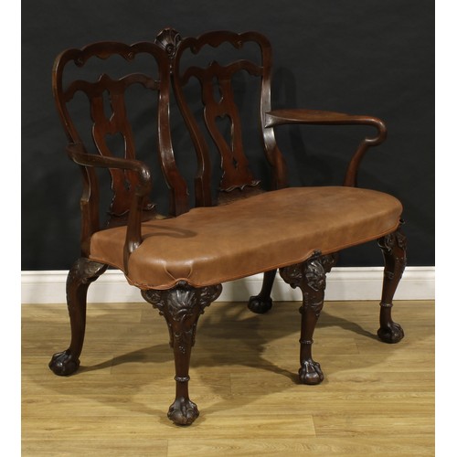 2362 - A George II Revival mahogany double-chair-back sofa, in the Irish taste, pierced vasular splats, stu... 